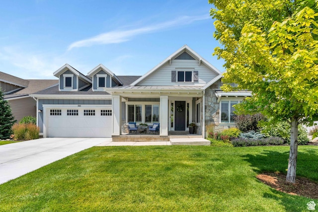 740 S Appenzell Ct, Midway, UT 84049 - view of front facade featuring a garage, concrete driveway, a standing seam roof, covered porch, and a front yard