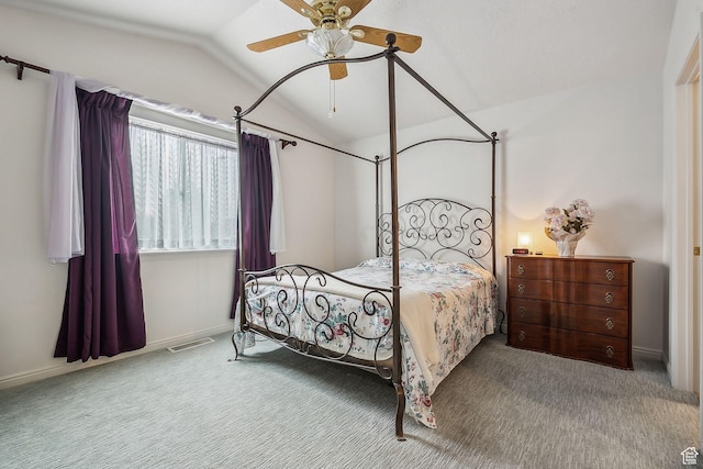 bedroom featuring carpet floors, lofted ceiling, visible vents, and baseboards