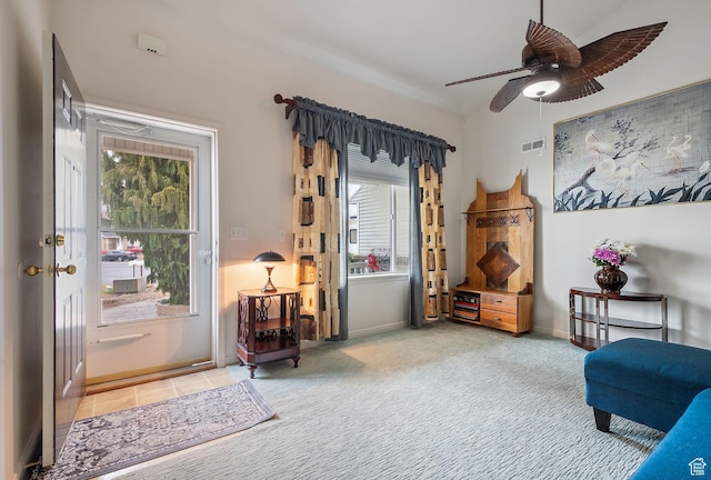 sitting room with ceiling fan, carpet, visible vents, and baseboards