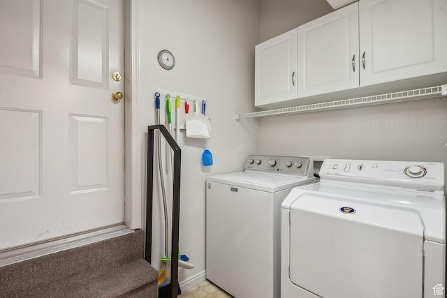 washroom with independent washer and dryer and cabinet space