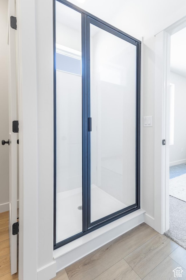 3062 N 2875 W Unit 24, Plain City, UT 84404 - full bath with wood finished floors, a shower stall, and baseboards