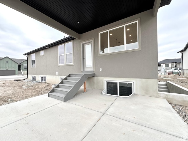 3062 N 2875 W Unit 24, Plain City, UT 84404 - rear view of house with a patio area and stucco siding