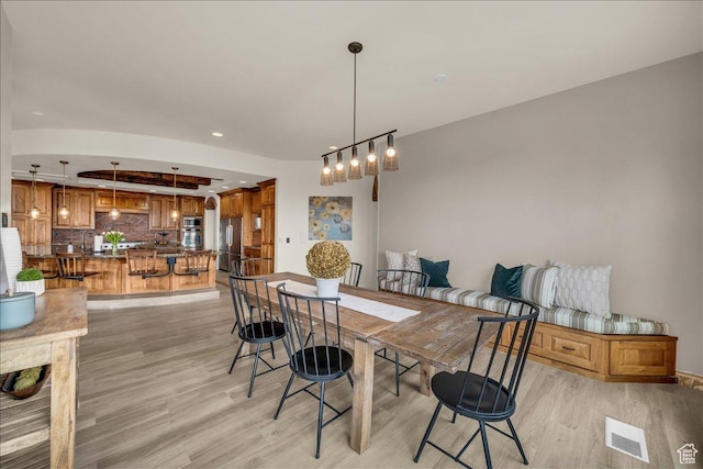 dining area featuring recessed lighting, visible vents, and light wood-style flooring