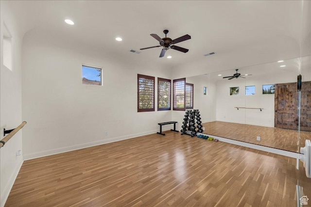 workout room with light wood-type flooring, visible vents, and recessed lighting