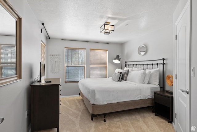 1808 W Fox Bay Dr Unit B304, Heber City, UT 84032 - bedroom with light carpet, a textured ceiling, and baseboards