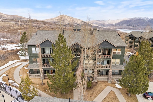 1808 W Fox Bay Dr Unit B304, Heber City, UT 84032 - view of building exterior featuring fence and a mountain view