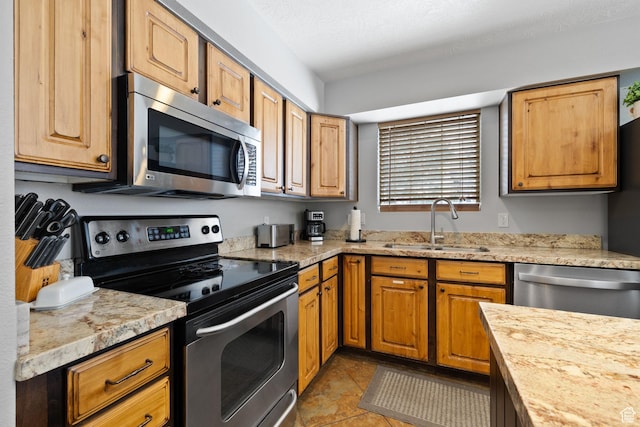 1808 W Fox Bay Dr Unit B304, Heber City, UT 84032 - kitchen with stainless steel appliances, tile patterned flooring, and a sink