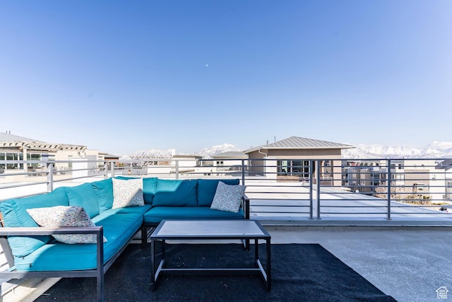 view of patio featuring outdoor lounge area and a balcony