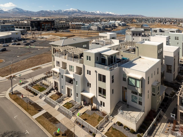 birds eye view of property with a mountain view