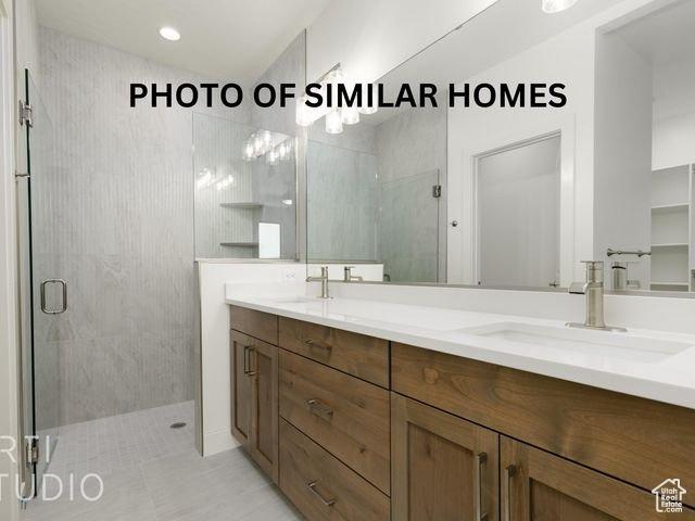 1555 W 470 N, Hurricane, UT 84737 - full bathroom with a stall shower, a sink, and double vanity