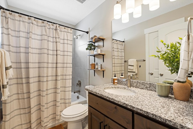 full bath featuring toilet, shower / bath combo, and vanity