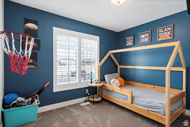 bedroom featuring carpet flooring and baseboards