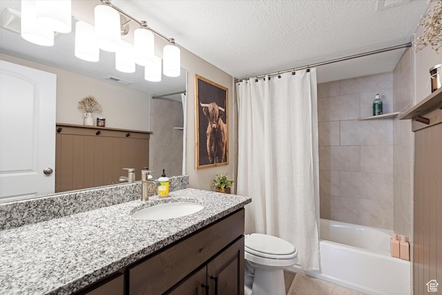 bathroom with visible vents, toilet, vanity, a textured ceiling, and shower / bathtub combination with curtain