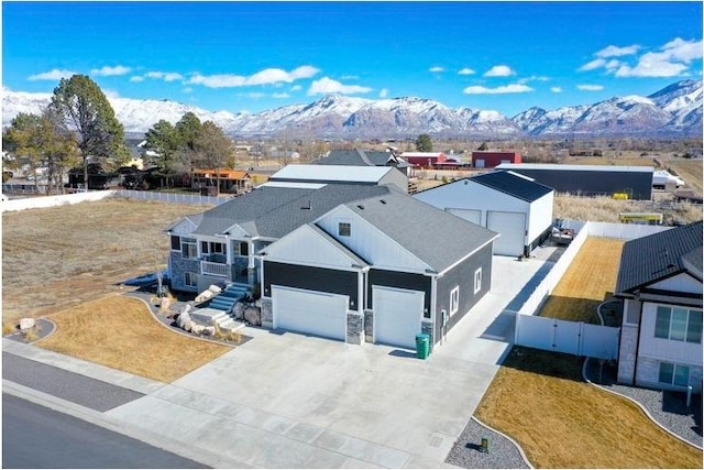 drone / aerial view featuring a mountain view