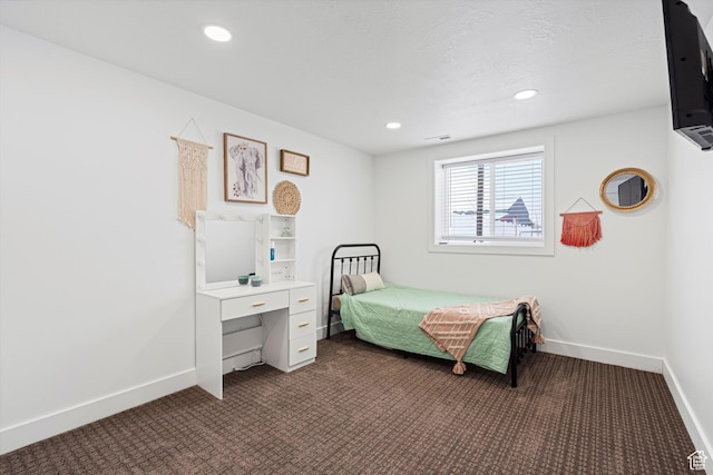 bedroom with recessed lighting, baseboards, and dark colored carpet
