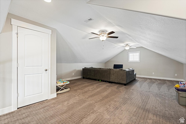 bonus room featuring baseboards, carpet floors, ceiling fan, and vaulted ceiling