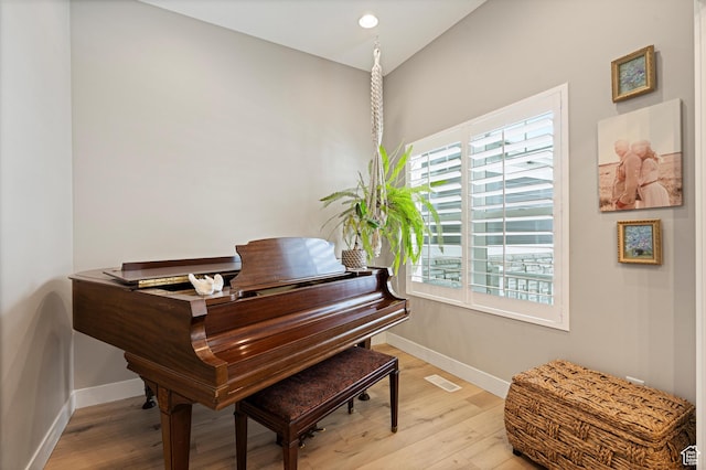 living area featuring recessed lighting, light wood-type flooring, baseboards, and visible vents