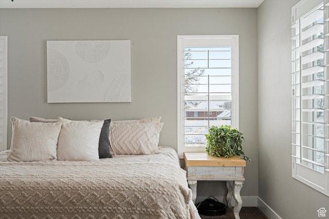 bedroom featuring baseboards
