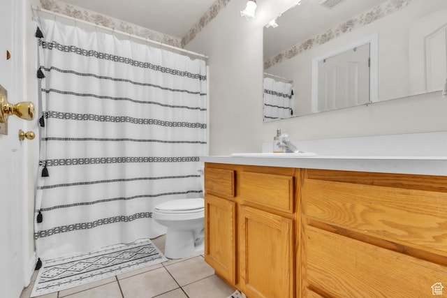 bathroom with visible vents, a shower with shower curtain, toilet, tile patterned floors, and vanity