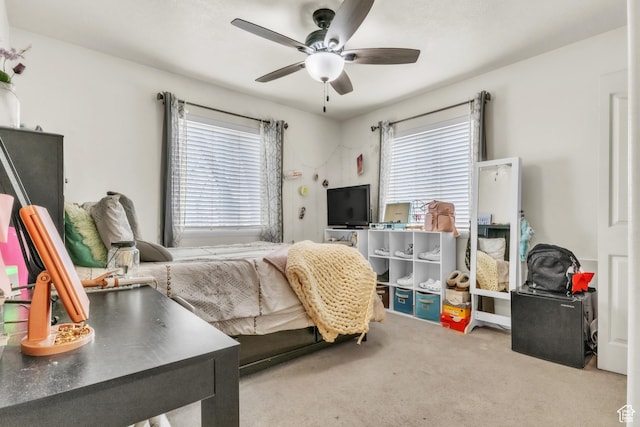 carpeted bedroom featuring ceiling fan