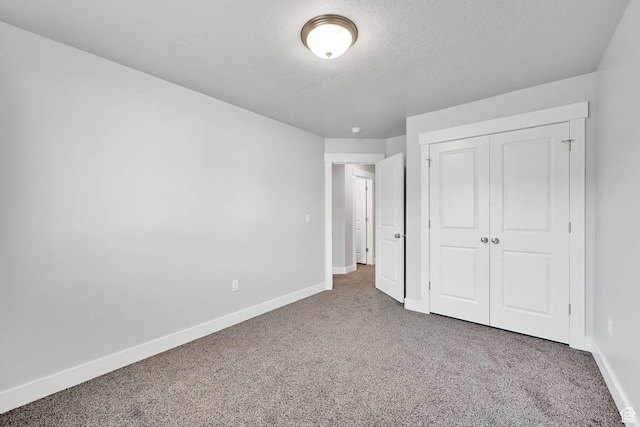 6512 S 390 E, South Weber, UT 84405 - unfurnished bedroom with a closet, carpet flooring, a textured ceiling, and baseboards