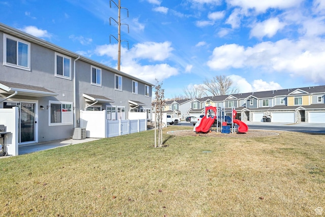 6512 S 390 E, South Weber, UT 84405 - view of yard with a playground, cooling unit, a residential view, and fence