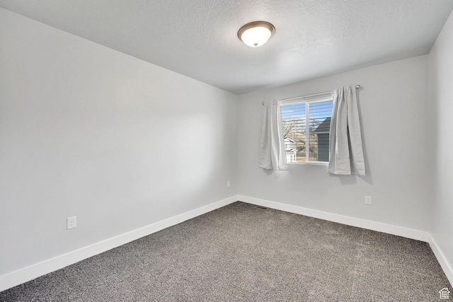 6512 S 390 E, South Weber, UT 84405 - unfurnished room featuring dark carpet, a textured ceiling, and baseboards