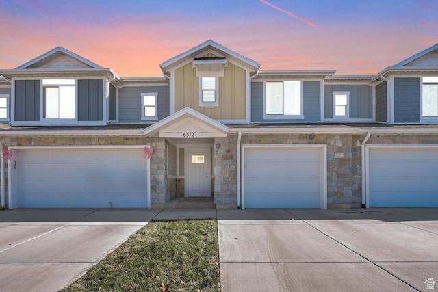 6512 S 390 E, South Weber, UT 84405 - view of property featuring driveway, a garage, and board and batten siding