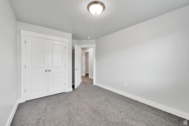 6512 S 390 E, South Weber, UT 84405 - unfurnished bedroom featuring carpet floors, a textured ceiling, baseboards, and a closet