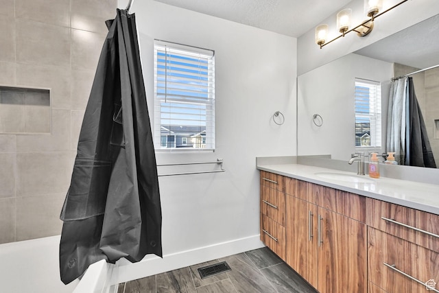 6512 S 390 E, South Weber, UT 84405 - bathroom with shower / bath combo, visible vents, vanity, and baseboards