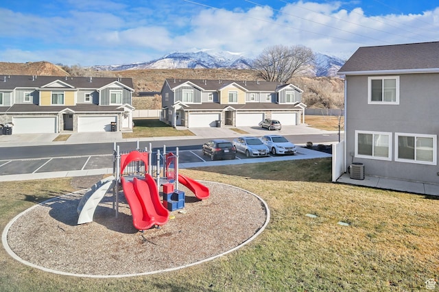 6512 S 390 E, South Weber, UT 84405 - community jungle gym with a residential view, central air condition unit, a mountain view, and a lawn
