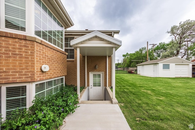 doorway to property featuring brick siding and a lawn