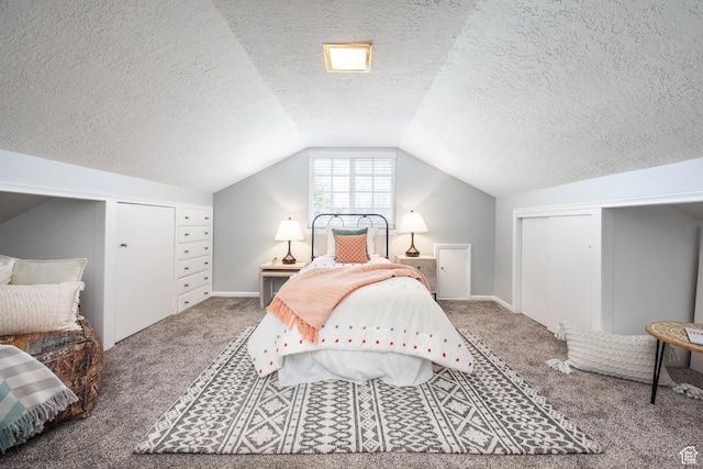 bedroom with carpet flooring, a textured ceiling, lofted ceiling, and baseboards