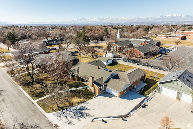 aerial perspective of suburban area featuring a mountainous background