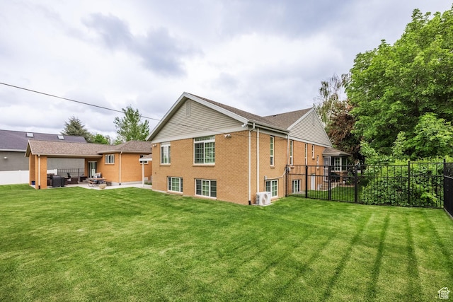 rear view of property with brick siding and a patio