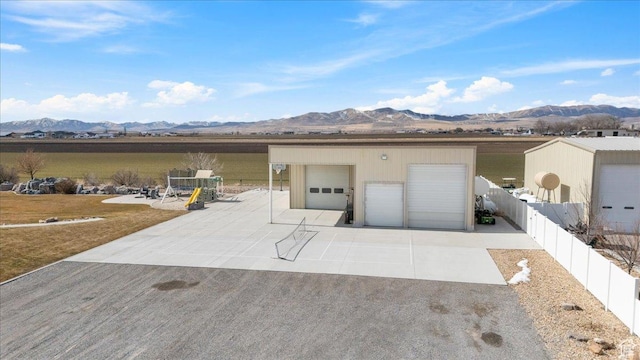 10285 N 7600 W, Tremonton, UT 84337 - detached garage featuring a mountain view and fence