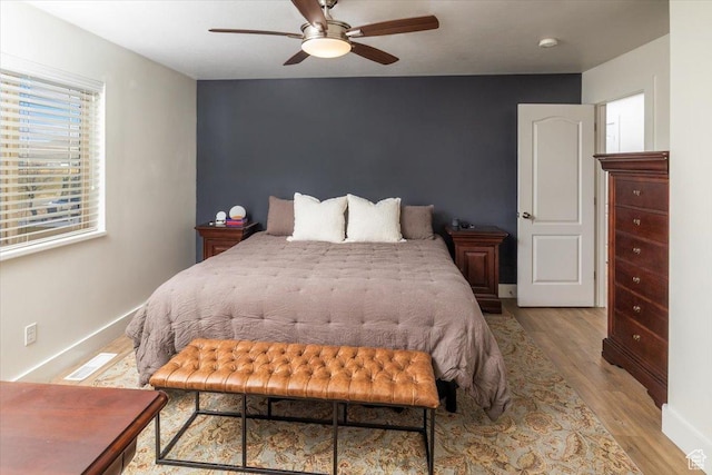 10285 N 7600 W, Tremonton, UT 84337 - bedroom featuring baseboards, visible vents, and wood finished floors