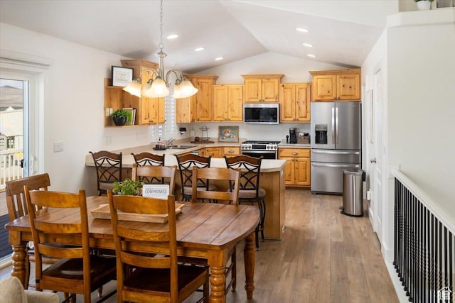 10285 N 7600 W, Tremonton, UT 84337 - dining area with a notable chandelier, light wood finished floors, recessed lighting, and vaulted ceiling
