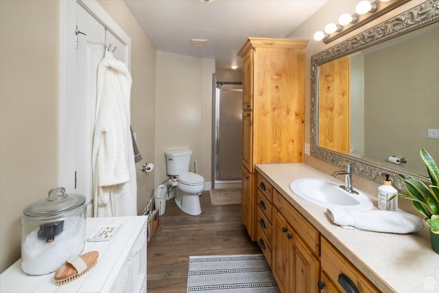 10285 N 7600 W, Tremonton, UT 84337 - full bathroom with a shower stall, vanity, toilet, and wood finished floors