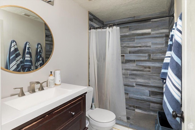 10285 N 7600 W, Tremonton, UT 84337 - bathroom featuring toilet, a textured ceiling, tiled shower, and visible vents