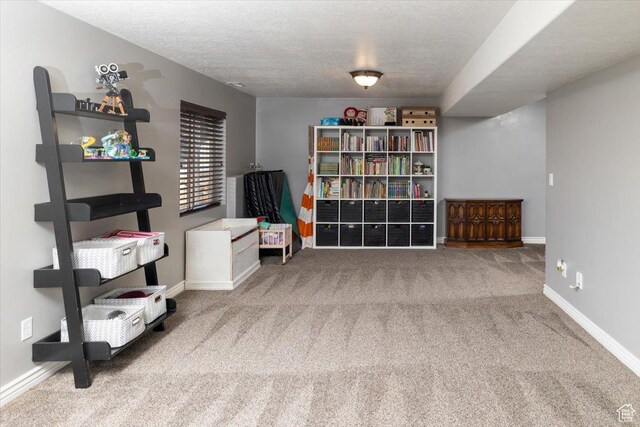 10285 N 7600 W, Tremonton, UT 84337 - living area featuring carpet, a textured ceiling, and baseboards