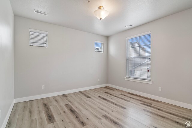 14648 S Mckellen Dr W Unit B203, Herriman, UT 84096 - empty room with wood finished floors and baseboards