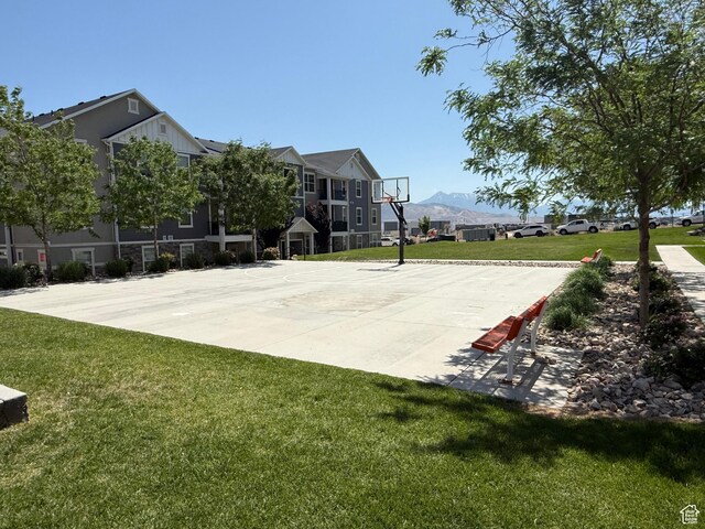14648 S Mckellen Dr W Unit B203, Herriman, UT 84096 - view of sport court featuring community basketball court, a yard, and a mountain view