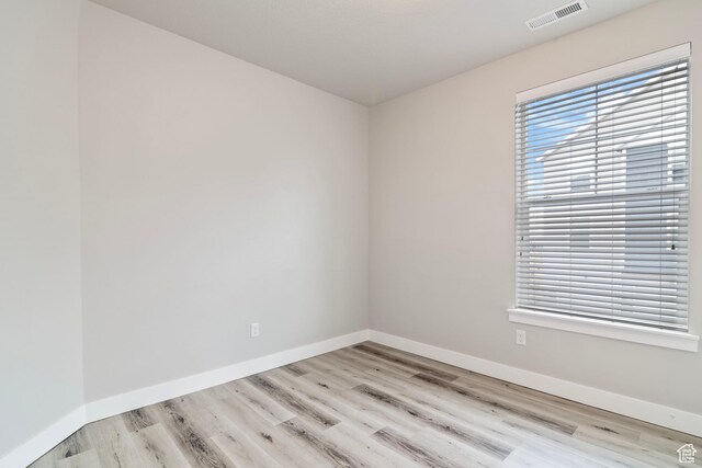 14648 S Mckellen Dr W Unit B203, Herriman, UT 84096 - spare room featuring wood finished floors and baseboards