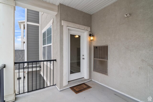 14648 S Mckellen Dr W Unit B203, Herriman, UT 84096 - view of exterior entry featuring a balcony and stucco siding