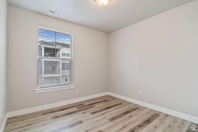 14648 S Mckellen Dr W Unit B203, Herriman, UT 84096 - spare room featuring wood finished floors and baseboards