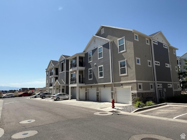 14648 S Mckellen Dr W Unit B203, Herriman, UT 84096 - view of building exterior with an attached garage