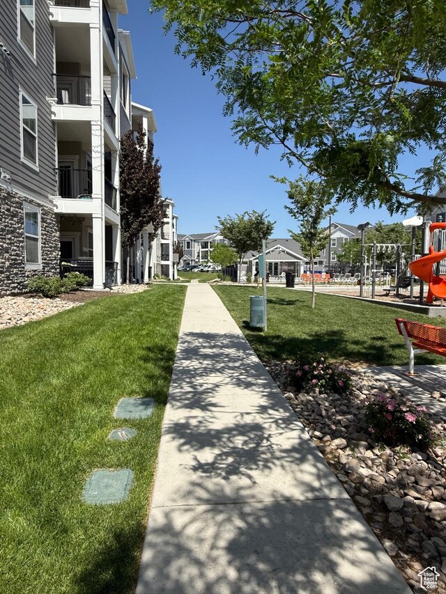 14648 S Mckellen Dr W Unit B203, Herriman, UT 84096 - view of property's community featuring a lawn