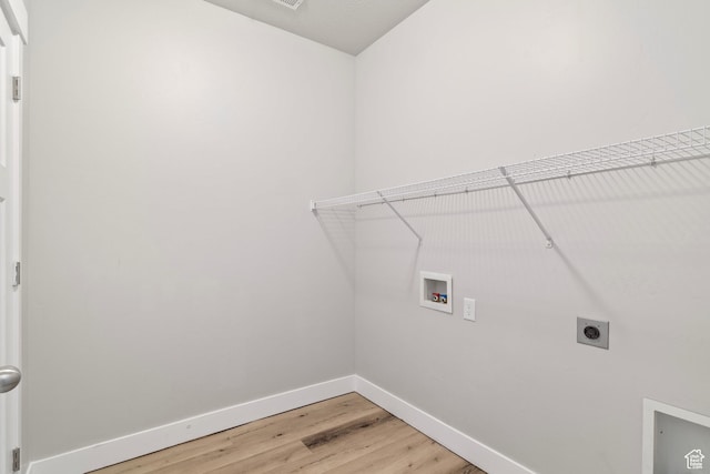 14648 S Mckellen Dr W Unit B203, Herriman, UT 84096 - laundry area with washer hookup, electric dryer hookup, baseboards, and light wood finished floors