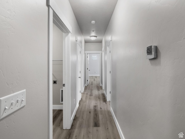 14648 S Mckellen Dr W Unit B203, Herriman, UT 84096 - corridor with light wood-style flooring and baseboards